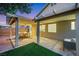 Covered patio with outdoor furniture and views into the home at 679 Riverband Pl, Henderson, NV 89052