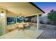 Covered patio with outdoor dining set perfect for entertaining and relaxing at 679 Riverband Pl, Henderson, NV 89052
