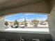 Overlooking a view of neighborhood buildings, parking, landscaping, and blue skies at 698 S Racetrack Rd # 322, Henderson, NV 89015