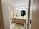 Bright bathroom features a shower/tub combination, vanity with storage, and modern lighting at 698 S Racetrack Rd # 322, Henderson, NV 89015