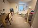 Spacious bedroom with a desk area, a large window, and comfortable seating at 698 S Racetrack Rd # 322, Henderson, NV 89015