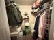 Walk-in closet with shelving and hanging space for clothes and accessories at 698 S Racetrack Rd # 322, Henderson, NV 89015