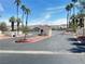 Secured community gate with desert landscaping and a picturesque mountain backdrop at 698 S Racetrack Rd # 322, Henderson, NV 89015