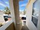 Exterior view of apartments showcasing stairs, landscape, and covered parking at 698 S Racetrack Rd # 322, Henderson, NV 89015