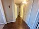 Hallway with wood floors and neutral wall colors at 698 S Racetrack Rd # 322, Henderson, NV 89015