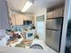 Efficient kitchen featuring essential appliances and a window at 698 S Racetrack Rd # 322, Henderson, NV 89015