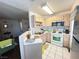 Bright kitchen featuring essential appliances and ample counter space at 698 S Racetrack Rd # 322, Henderson, NV 89015