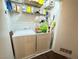 Functional laundry room with washer, dryer, shelving, storage and easy access to the outside at 698 S Racetrack Rd # 322, Henderson, NV 89015