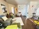 Cozy living room showcasing hardwood floors, neutral walls, and a comfortable seating arrangement at 698 S Racetrack Rd # 322, Henderson, NV 89015
