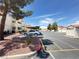 Exterior view of well-maintained apartments near covered parking, landscaping and colorful accents at 698 S Racetrack Rd # 322, Henderson, NV 89015