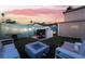 Outdoor grill area with a modern fire pit, perfect for entertaining guests in the beautifully landscaped backyard at 7018 Berkshire Pl, Las Vegas, NV 89147