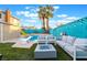 Backyard features a diving board, patio seating, fire pit, pool and privacy fence at 7018 Berkshire Pl, Las Vegas, NV 89147