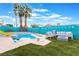 Backyard features a diving board, patio seating, fire pit, and privacy fence at 7018 Berkshire Pl, Las Vegas, NV 89147