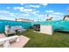Backyard features a built-in barbeque, patio seating, fire pit and privacy fence at 7018 Berkshire Pl, Las Vegas, NV 89147