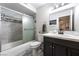 The bathroom features a bathtub with shower, dark vanity, and tile floors at 7018 Berkshire Pl, Las Vegas, NV 89147