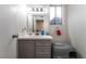 Well-lit bathroom featuring modern vanity, ample counter space, and automated cat-litter box at 7018 Berkshire Pl, Las Vegas, NV 89147