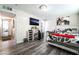Bedroom featuring a modern TV, bed, and lighting at 7018 Berkshire Pl, Las Vegas, NV 89147