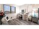 Bedroom featuring modern floors, bright natural light and lighted vanity at 7018 Berkshire Pl, Las Vegas, NV 89147