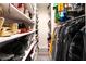 Walk-in closet with shoe rack, shelves and hanging clothes at 7018 Berkshire Pl, Las Vegas, NV 89147