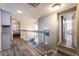 Hallway boasting modern floors, staircase, and ample natural light at 7018 Berkshire Pl, Las Vegas, NV 89147