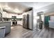 The bright, functional kitchen features stainless steel appliances, modern plank flooring, and ample counter space at 7018 Berkshire Pl, Las Vegas, NV 89147