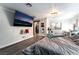 Spacious main bedroom features modern floors, large TV and walk-in closet at 7018 Berkshire Pl, Las Vegas, NV 89147