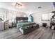Spacious main bedroom with plush bedding, accent furniture and great natural light at 7018 Berkshire Pl, Las Vegas, NV 89147