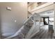 Bright, carpeted staircase leading to the second floor with contemporary metal railing and modern flooring at 7018 Berkshire Pl, Las Vegas, NV 89147