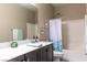 Bathroom featuring a vanity with a white countertop and a shower with a curtain at 7175 Steubling Glen St, North Las Vegas, NV 89084