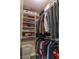 Walk-in closet has custom built-ins, shelving, and hanging rods at 7175 Steubling Glen St, North Las Vegas, NV 89084