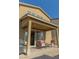Spacious covered patio with outdoor seating overlooking the low maintenance backyard at 7175 Steubling Glen St, North Las Vegas, NV 89084