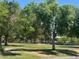 Green space in community park offering lush trees and play areas at 7300 Mountain Moss Dr, Las Vegas, NV 89147