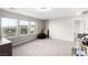 Large bonus room offering three windows, neutral carpet, and ample space for versatile use at 7733 Rosebark Cliffs St, North Las Vegas, NV 89084
