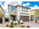 Charming two-story home featuring a brick-paved driveway and a well-maintained, drought-resistant landscaped yard at 7733 Rosebark Cliffs St, North Las Vegas, NV 89084