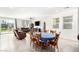 Open-concept living and dining area with sliding glass doors to the backyard for seamless indoor-outdoor living at 7733 Rosebark Cliffs St, North Las Vegas, NV 89084