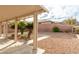 Backyard featuring gravel landscaping with trees and covered patio at 787 Craigmark Ct, Henderson, NV 89002