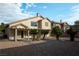 Relaxing backyard with a covered patio, mature trees, and a stone pathway at 787 Craigmark Ct, Henderson, NV 89002