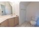 Clean bathroom featuring a vanity with sink, a toilet, and a large mirror at 787 Craigmark Ct, Henderson, NV 89002