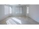 Bright bedroom with neutral carpeting and large windows at 787 Craigmark Ct, Henderson, NV 89002