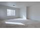 Bright bedroom with neutral carpeting and large window at 787 Craigmark Ct, Henderson, NV 89002