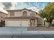 Beautiful two-story home with a three-car garage and a neatly landscaped front yard at 787 Craigmark Ct, Henderson, NV 89002