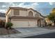 Charming two-story home with a well-manicured lawn and a spacious three-car garage at 787 Craigmark Ct, Henderson, NV 89002