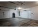 Spacious garage with concrete flooring, storage racks, and lighting at 787 Craigmark Ct, Henderson, NV 89002