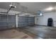 A spacious garage features multiple parking spaces, storage racks, and automatic door openers at 787 Craigmark Ct, Henderson, NV 89002