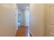 Hallway with light walls and wood flooring leading to rooms at 787 Craigmark Ct, Henderson, NV 89002