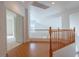 Hallway with wooden banister and scenic view at 787 Craigmark Ct, Henderson, NV 89002