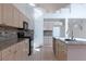 Well-lit kitchen features stainless steel appliances, granite countertops, and ample cabinet space at 787 Craigmark Ct, Henderson, NV 89002