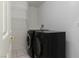 Dedicated laundry room features a washer, dryer, and shelving at 787 Craigmark Ct, Henderson, NV 89002