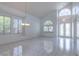 Open living area with abundant natural light, tile floors, and elegant chandelier at 787 Craigmark Ct, Henderson, NV 89002