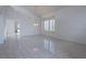Expansive living room with tile flooring, high ceilings, and abundant natural light at 787 Craigmark Ct, Henderson, NV 89002